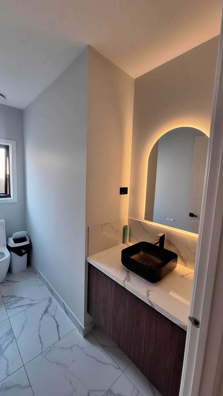 Custom bathroom with vessel sink and LED mirror
